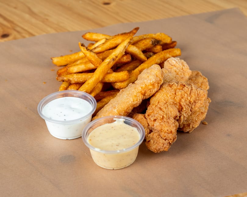 Crispy chicken tenders and golden french fries with ranch and honey mustard dipping sauces.